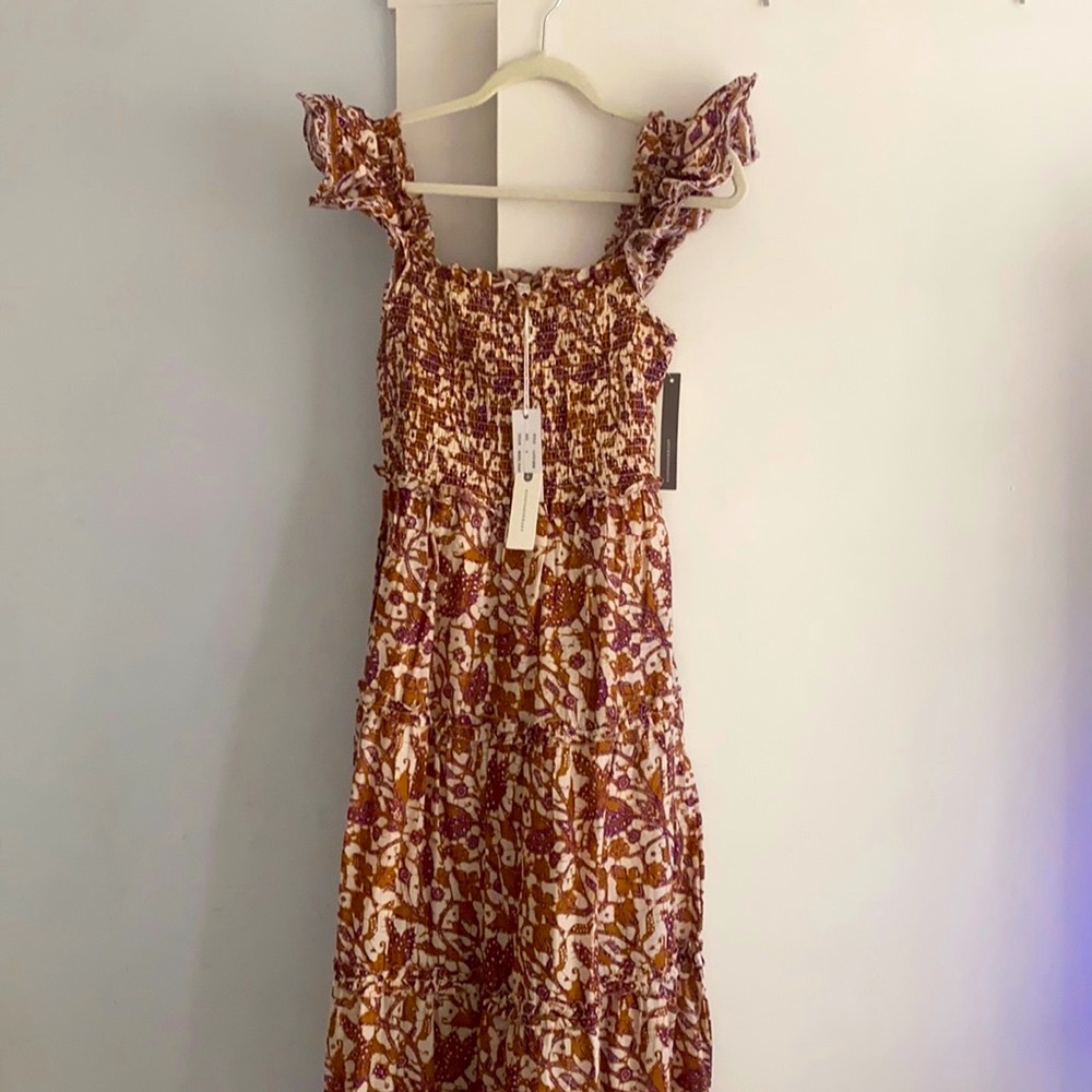 Anthropologie dress size small. Never worn with tags on it still.